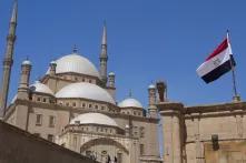 mosk in cairo with egyprian flag in front of it